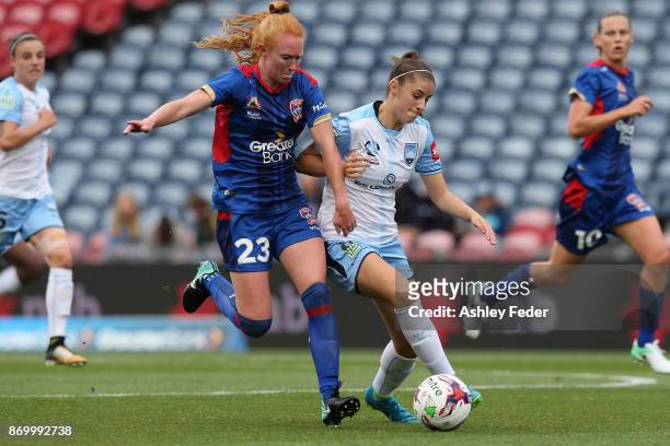 Tori Huster of the Jets contests the ball against Amy Harrison of Sydney FC during the round two W-League match between the Newcastle Jets and Sydney...