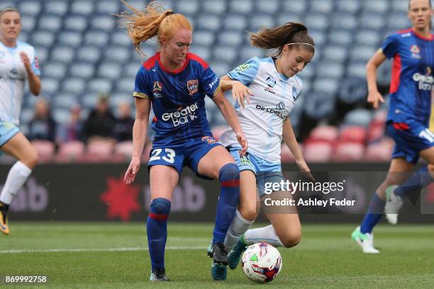 Tori Huster of the Jets contests the ball against Amy Harrison of Sydney FC during the round two W-League match between the Newcastle Jets and Sydney...