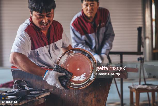 traditional glassblowing worker shaping glass - glass blowing stock pictures, royalty-free photos & images