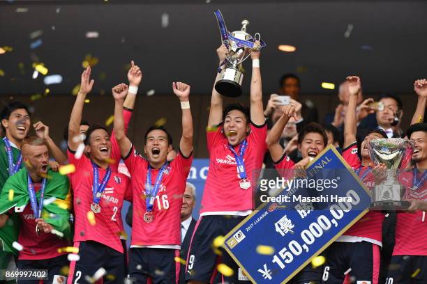 Players of Cerezo Osaka celebrate as Kenyu Sugimoto lifts the trophy after the J.League Levain Cup final match between Cerezo Osaka and Kawasaki...