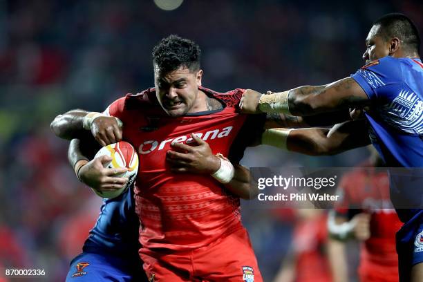 Andrew Fifita of Tonga is tackled during the 2017 Rugby League World Cup match between Samoa and Tonga at Waikato Stadium on November 4, 2017 in...