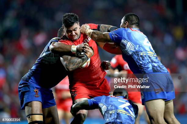 Andrew Fifita of Tonga is tackled during the 2017 Rugby League World Cup match between Samoa and Tonga at Waikato Stadium on November 4, 2017 in...