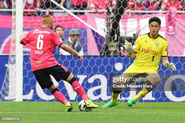 Souza of Cerezo Osaka runs past Jung Sung Ryong to score the second goal during the J.League Levain Cup final match between Cerezo Osaka and Kawasaki...