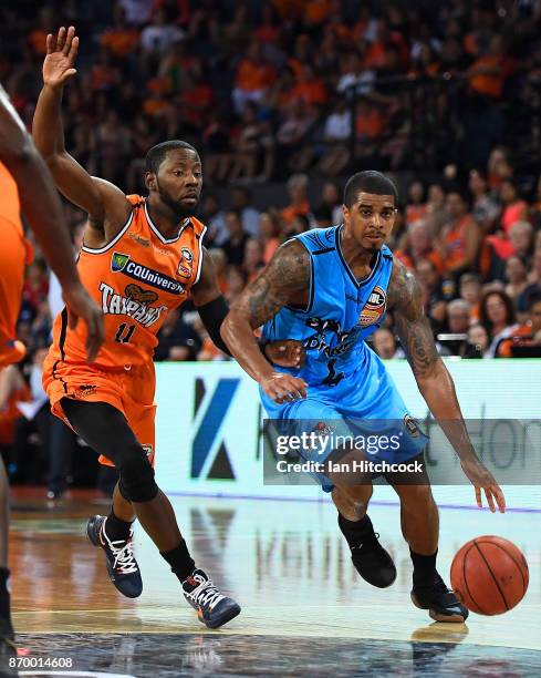 Edgar Sosa of the Breakers drives to the basket past Scoochie Smith of the Taipans during the round five NBL match between the Cairns Taipans and the...