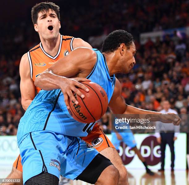 Mika Vukona of the Breakers drives to the basket past Stephen Weigh of the Taipans during the round five NBL match between the Cairns Taipans and the...