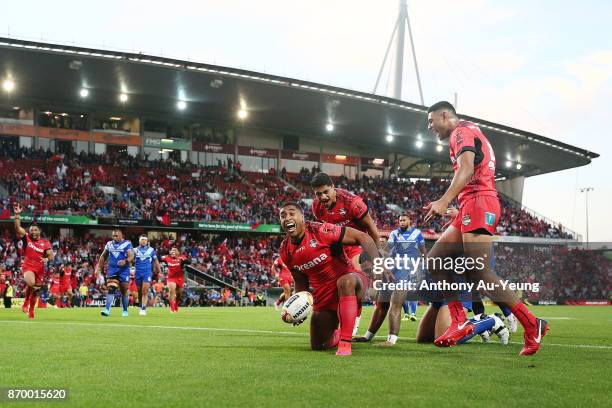 Michael Jennings of Tonga scores a try during the 2017 Rugby League World Cup match between Samoa and Tonga at Waikato Stadium on November 4, 2017 in...