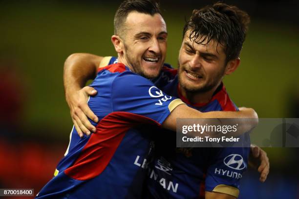 Roy O'Donovan of the Jets celebrates a goal with teammate Ivan Vujica during the round five A-League match between the Newcastle Jets and the...