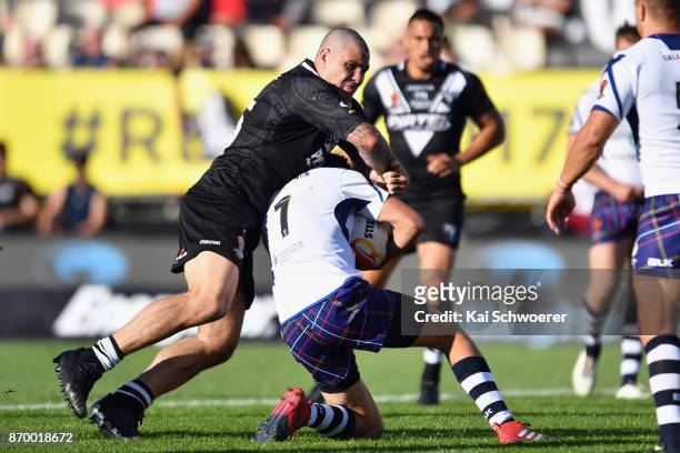 Russell Packer of the Kiwis tackles Alex Walker of Scotland during the 2017 Rugby League World Cup match between the New Zealand Kiwis and Scotland...