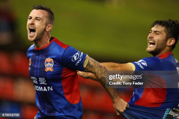 Roy O'Donovan of the Jets celebrates a goal with teammate Ivan Vujica during the round five A-League match between the Newcastle Jets and the...