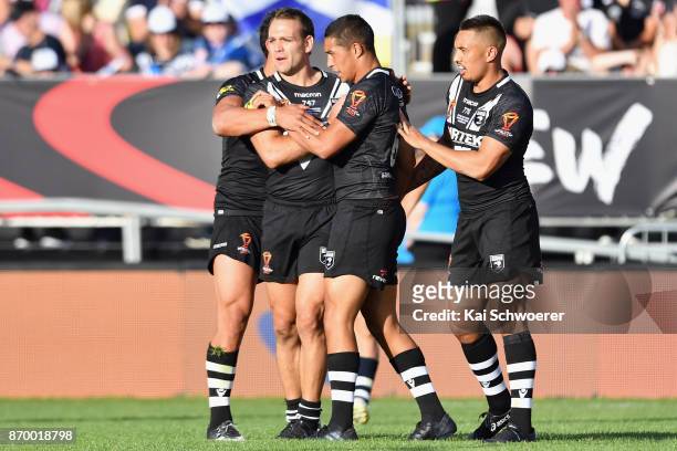 Jason Nightingale is congratulated by Te Maire Martin and Dean Whare of the Kiwis after scoring a try during the 2017 Rugby League World Cup match...