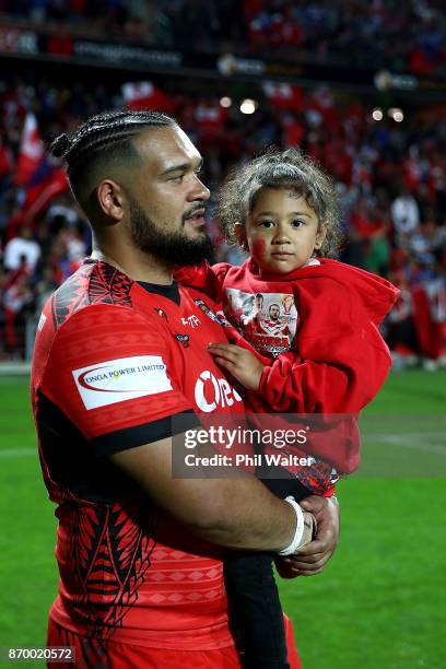 Ben Murdoch-Masila of Tonga holds his daughter following the 2017 Rugby League World Cup match between Samoa and Tonga at Waikato Stadium on November...