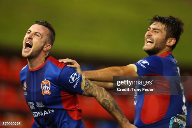 Roy O'Donovan of the Jets celebrates a goal with teammate Ivan Vujica during the round five A-League match between the Newcastle Jets and the...