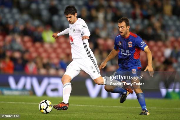 Guilherme Finkler of the Phoenix contests the ball with Ben Kantarovski of the Jets during the round five A-League match between the Newcastle Jets...