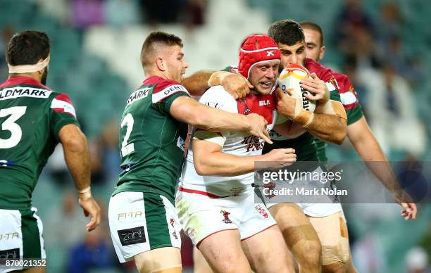 Chris Hill of England is tackled during the 2017 Rugby League World Cup match between England and Lebanon at Allianz Stadium on November 4, 2017 in...