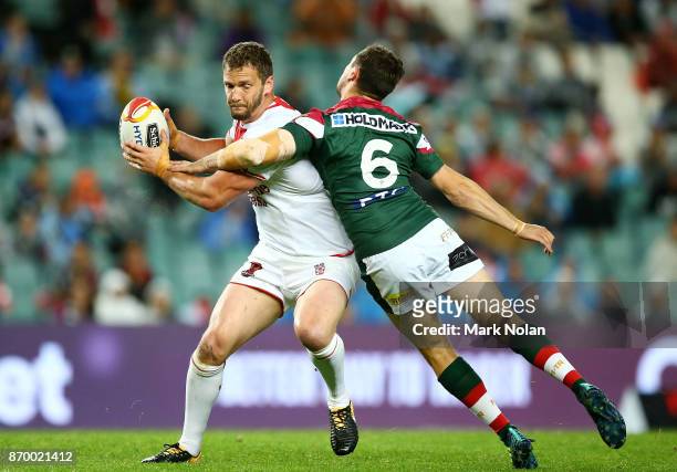 Sean O'Loughlin of England is tackled by Mitchell Moses of Lebanon during the 2017 Rugby League World Cup match between England and Lebanon at...