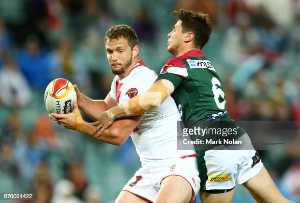 Sean O'Loughlin of England is tackled by Mitchell Moses of Lebanon during the 2017 Rugby League World Cup match between England and Lebanon at...