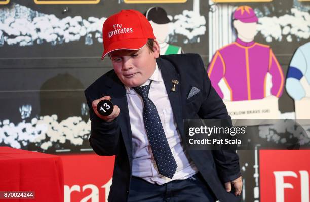 Noah Johnston draws barrier 13 for Humidor during The Melbourne Cup Barrier Draw at Flemington Racecourse on November 04, 2017 in Flemington,...