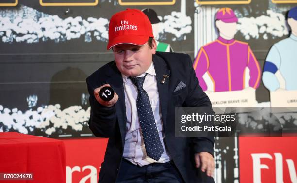 Noah Johnston draws barrier 13 for Humidor during The Melbourne Cup Barrier Draw at Flemington Racecourse on November 04, 2017 in Flemington,...