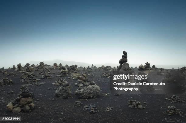 stone heaps - daniele carotenuto stock pictures, royalty-free photos & images