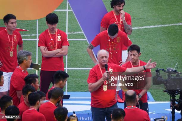 Head coach Luiz Felipe Scolari and players of Guangzhou Evergrande attend the Champion Award Ceremony for 2017 Chinese Football Association Super...