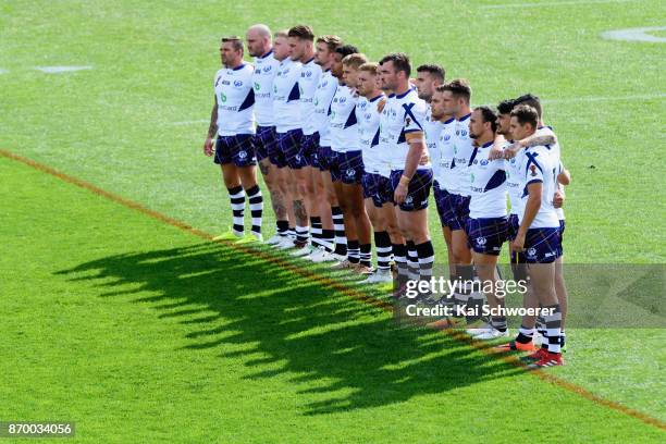 Scotland look on while the Kiwis perform the Haka prior to the 2017 Rugby League World Cup match between the New Zealand Kiwis and Scotland at AMI...