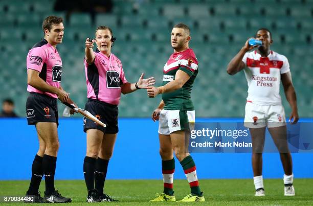 Robbie Farah of Lebanon makes an official complaint of biting against Jermaine McGillvary of England during the 2017 Rugby League World Cup match...