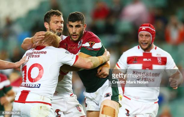 Alex Twal of Lebanon is tackled during the 2017 Rugby League World Cup match between England and Lebanon at Allianz Stadium on November 4, 2017 in...
