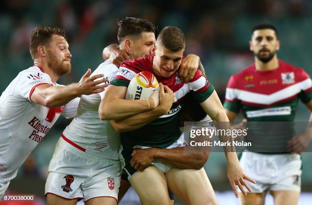 Adam Doueihi of Lebanon is tackled during the 2017 Rugby League World Cup match between England and Lebanon at Allianz Stadium on November 4, 2017 in...