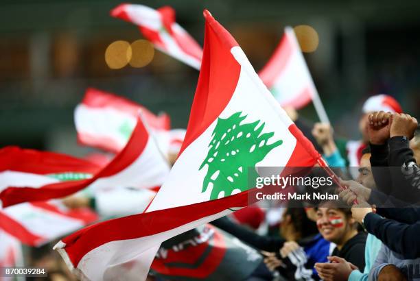 Lebanese supporters wave flags during the 2017 Rugby League World Cup match between England and Lebanon at Allianz Stadium on November 4, 2017 in...