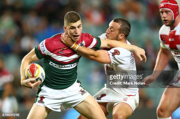 Adam Doueihi of Lebanon is tackled by Josh Hodgson of England during the 2017 Rugby League World Cup match between England and Lebanon at Allianz...