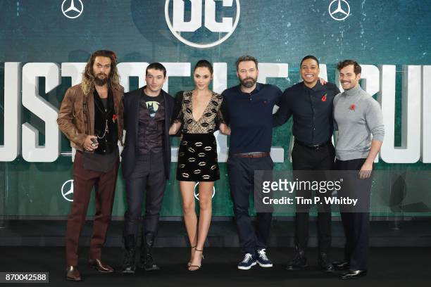 Actors Jason Momoa, Ezra Miller, Gal Gadot, Ben Affleck, Ray Fisher and Henry Cavill attend the 'Justice League' photocall at The College on November...