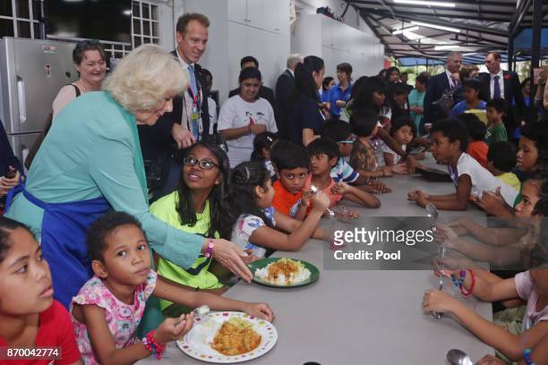 Camilla, The Duchess of Cornwall serving food for residents at The Lighthouse Children's Welfare Centre, during a visit to The Lost Food Project -...