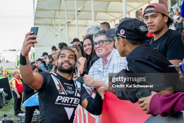 Adam Blair of the Kiwis takes a selfie with fans after their win in the 2017 Rugby League World Cup match between the New Zealand Kiwis and Scotland...