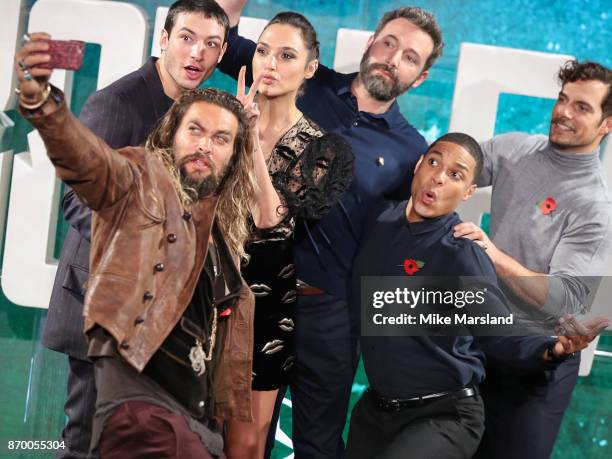 Jason Momoa, Ezra Miller, Gal Gadot, Ben Affleck, Ray Fisher and Henry Cavill attend the 'Justice League' photocall at The College on November 4,...