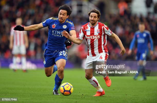 Shinji Okazaki of Leicester City and Joe Allen of Stoke City during the Premier League match between Stoke City and Leicester City at Bet365 Stadium...