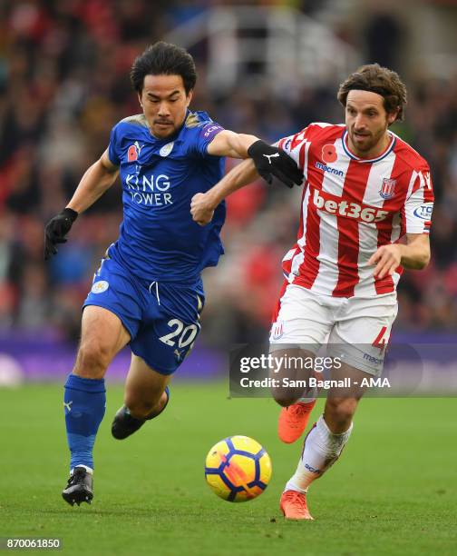 Shinji Okazaki of Leicester City and Joe Allen of Stoke City during the Premier League match between Stoke City and Leicester City at Bet365 Stadium...