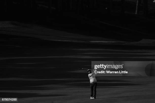 Andrew Johnson of England plays his second shot into the the 11th green during the third round of the Turkish Airlines Open at the Regnum Carya Golf...