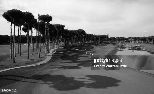 Players walk onto the 11th green during the third round of the Turkish Airlines Open at the Regnum Carya Golf & Spa Resort on November 4, 2017 in...