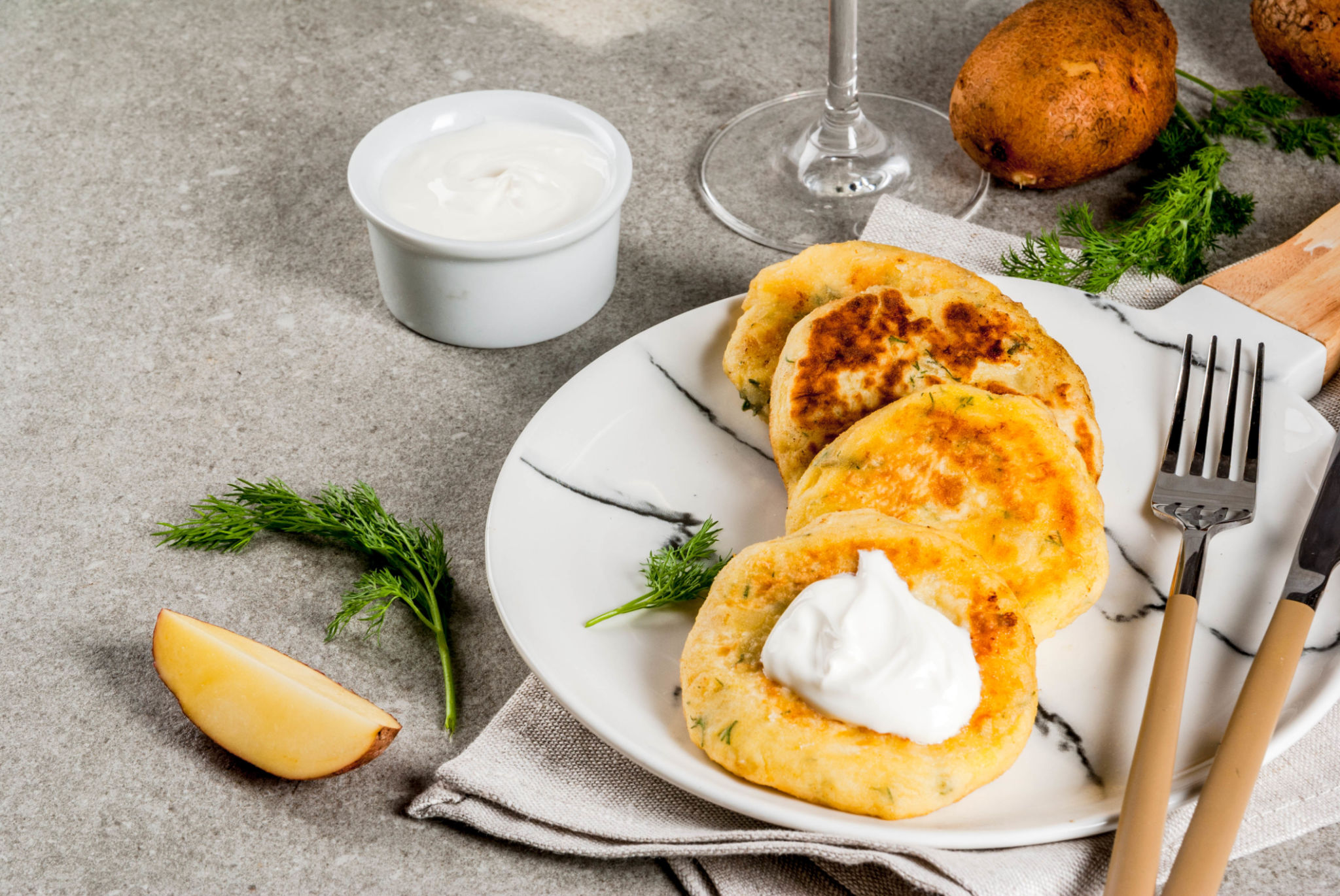 Mashed potato pancakes served with greek yoghurt Mashed potato pancakes served with greek yoghurt