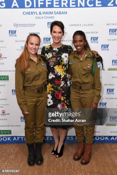 Cheryl Saban and Israeli soldiers at the FIDF Western Region Gala at The Beverly Hilton Hotel on November 2, 2017 in Beverly Hills, California.