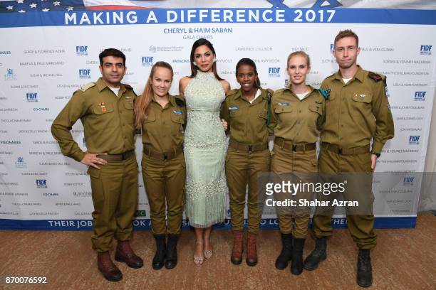 Moran Atias with IDF soldiers at the FIDF Western Region Gala at The Beverly Hilton Hotel on November 2, 2017 in Beverly Hills, California.