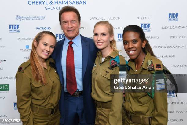 Arnold Schwarzenegger with IDF soldiers at the FIDF Western Region Gala at The Beverly Hilton Hotel on November 2, 2017 in Beverly Hills, California.
