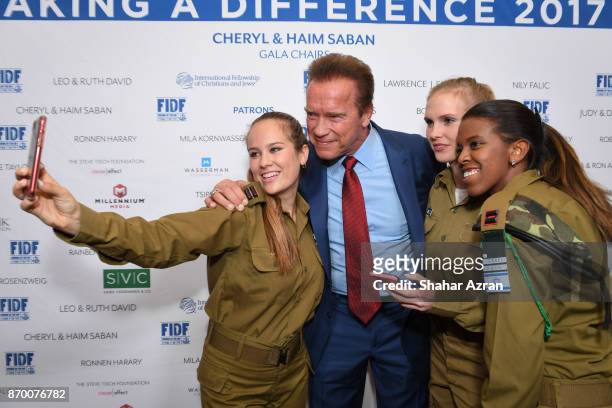 Arnold Schwarzenegger with IDF soldiers at the FIDF Western Region Gala at The Beverly Hilton Hotel on November 2, 2017 in Beverly Hills, California.