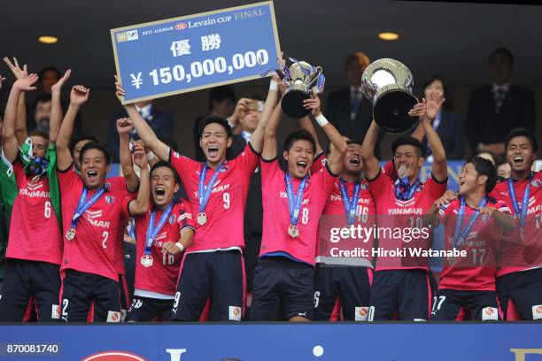 Players of Cerezo Osaka celebrate as captain Yoichiro Kakitani lifts the trophy after the J.League Levain Cup final match between Cerezo Osaka and...