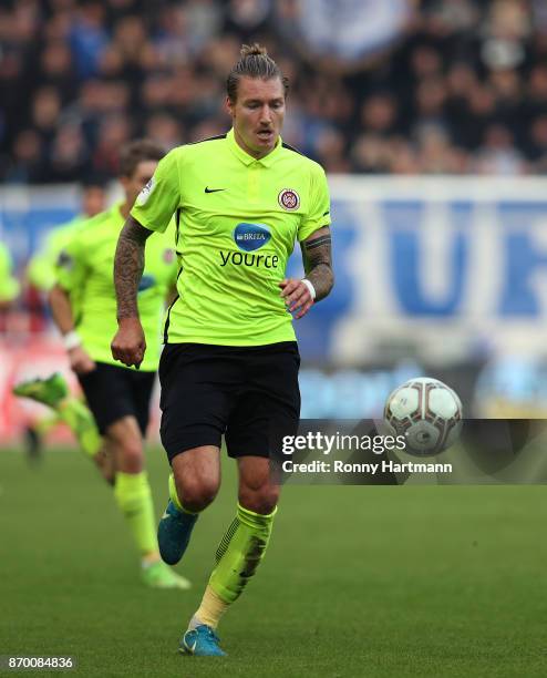 Manuel Schaeffler of Wiesbaden runs with the ball during the 3. Liga match between 1. FC Magdeburg and SV Wehen Wiesbaden at MDCC-Arena on November...