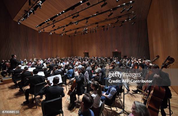 The audience joins musicians of the Park Avenue Chamber Symphony on stage during "InsideOut" at DiMenna Center in New York on October 28, 2017....