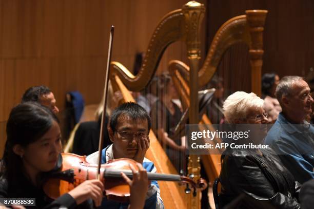 The audience joins musicians of the Park Avenue Chamber Symphony on stage during "InsideOut" at DiMenna Center in New York on October 28, 2017....