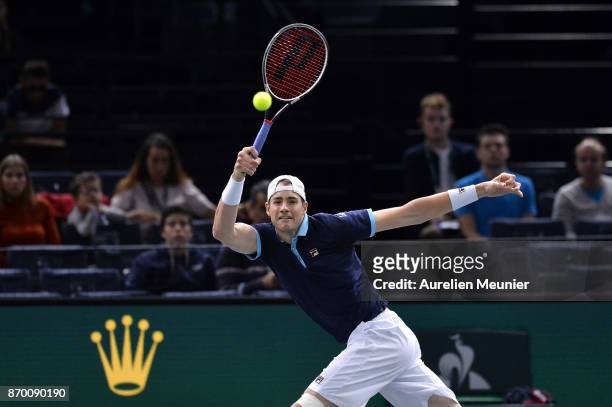 John Isner of the United States of America plays a forehand in the men's singles semi final match against Filip Krajinovic of Serbia during day six...