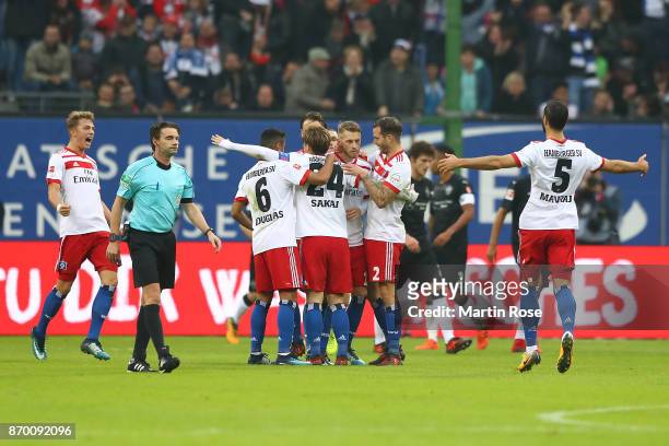 Players of Hamburg celebrate their first goal scored by Aaron Hunt of Hamburg to make it 1:0 during the Bundesliga match between Hamburger SV and VfB...