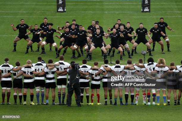 Barbarians players face down the New Zealand haka ahead of the international rugby union match between Barbarians and New Zealand at Twickenham in...